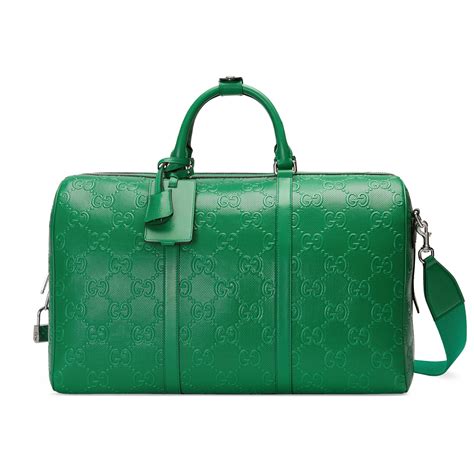 gucci mens gym bag|Gucci embossed duffle bag.